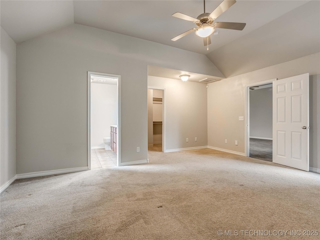 12520 S Birch Ave, Jenks, OK 74037 - unfurnished bedroom with vaulted ceiling, a spacious closet, light colored carpet, ensuite bathroom, and a closet