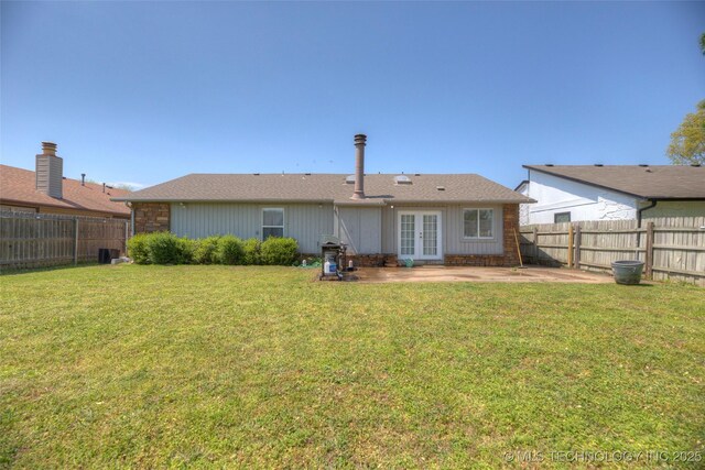 3249 S 138th E Ave, Tulsa, OK 74134 - back of property featuring a fenced backyard, french doors, a yard, and a patio