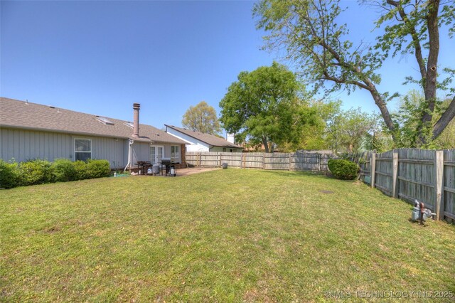 3249 S 138th E Ave, Tulsa, OK 74134 - view of yard featuring a fenced backyard and a patio area