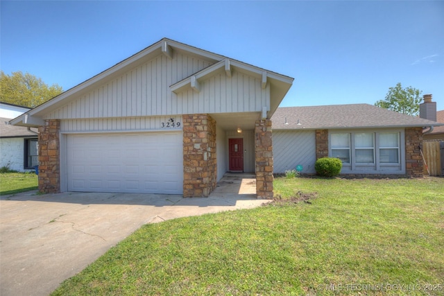 3249 S 138th E Ave, Tulsa, OK 74134 - ranch-style house with stone siding, an attached garage, driveway, and a chimney