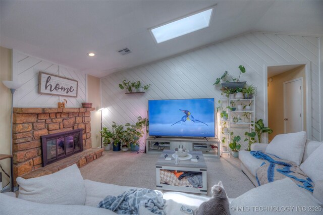 3249 S 138th E Ave, Tulsa, OK 74134 - living room featuring recessed lighting, carpet, a stone fireplace, visible vents, and vaulted ceiling with skylight