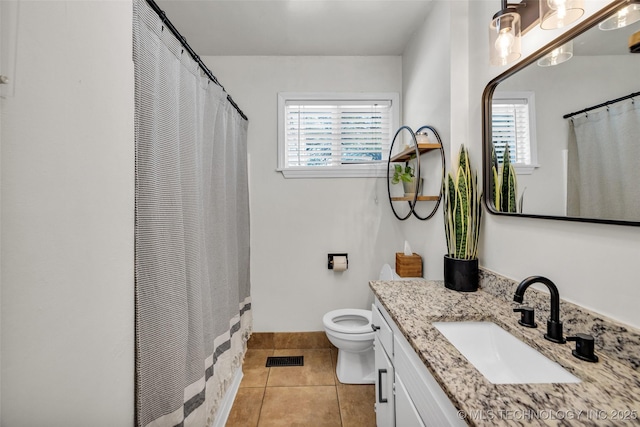 full bathroom featuring a wealth of natural light, tile patterned flooring, vanity, and toilet
