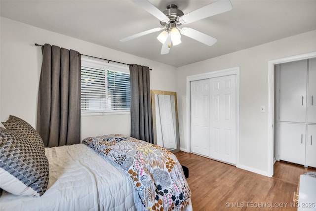bedroom featuring baseboards, a ceiling fan, and wood finished floors