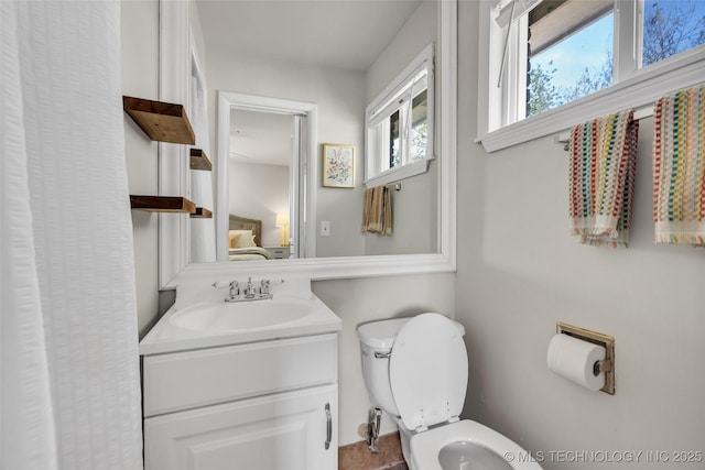 bathroom featuring vanity and toilet