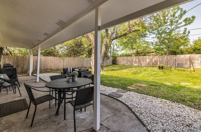 view of patio featuring outdoor dining space and a fenced backyard