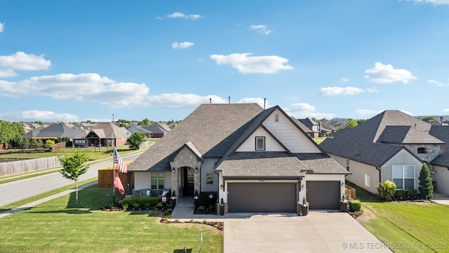18510 E 46th Pl S, Tulsa, OK 74134 - french provincial home featuring roof with shingles, a garage, a residential view, and concrete driveway
