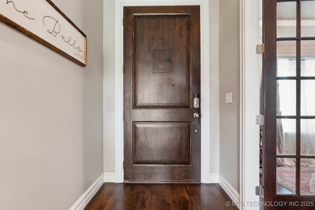 18510 E 46th Pl S, Tulsa, OK 74134 - doorway to outside featuring dark wood finished floors and baseboards