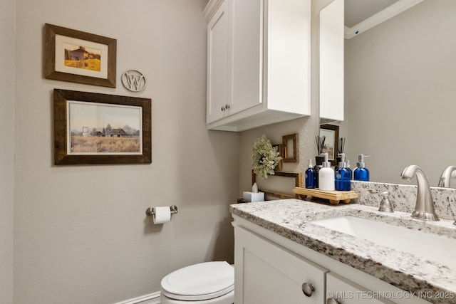 18510 E 46th Pl S, Tulsa, OK 74134 - half bathroom with vanity, toilet, and ornamental molding