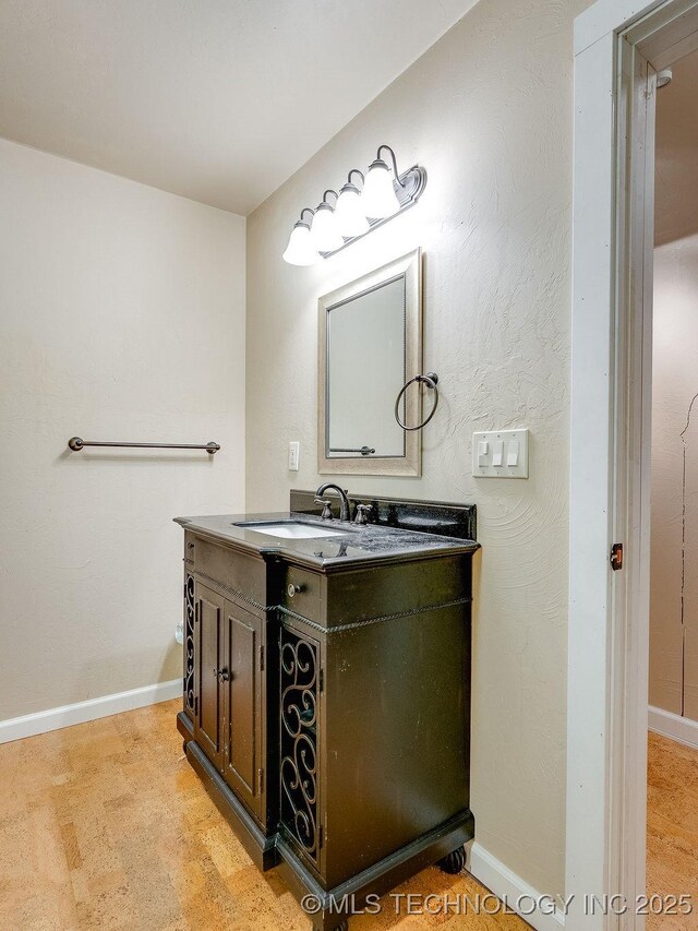 21125 State Highway 99 S, Stonewall, OK 74871 - bathroom featuring baseboards and vanity
