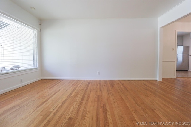 4335 S Cincinnati Ave, Tulsa, OK 74105 - spare room featuring baseboards and light wood-style floors