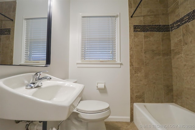 4335 S Cincinnati Ave, Tulsa, OK 74105 - bathroom with a sink, shower / bathing tub combination, baseboards, toilet, and tile patterned flooring