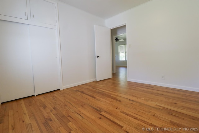 4335 S Cincinnati Ave, Tulsa, OK 74105 - unfurnished bedroom with light wood finished floors and baseboards