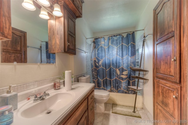 8939 E 3rd Pl, Tulsa, OK 74112 - bathroom with shower / bath combo, vanity, tile patterned flooring, and toilet