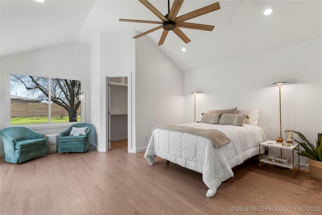 bedroom with recessed lighting, wood finished floors, a ceiling fan, baseboards, and high vaulted ceiling