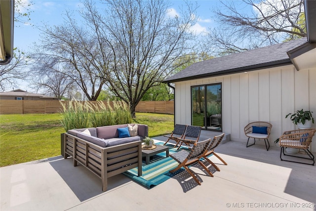 view of patio with an outdoor living space and a fenced backyard