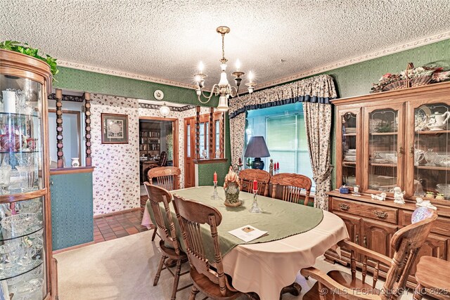2445 E 156th St N, Skiatook, OK 74070 - dining room with wallpapered walls, a textured ceiling, and a notable chandelier