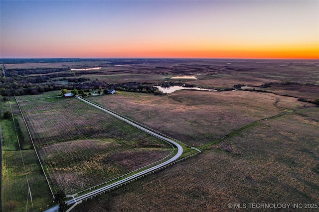 2445 E 156th St N, Skiatook, OK 74070 - aerial view at dusk featuring a rural view