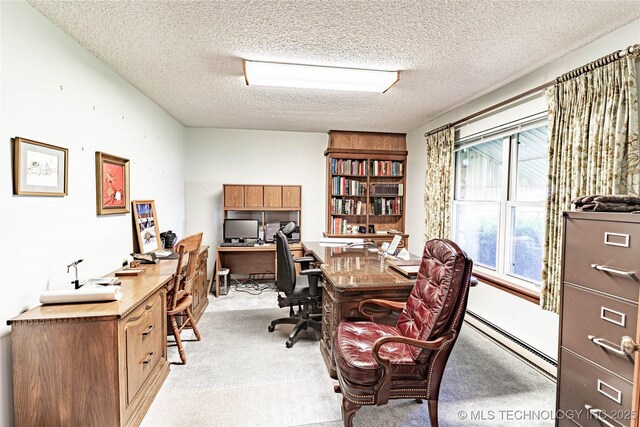 2445 E 156th St N, Skiatook, OK 74070 - home office featuring a baseboard heating unit, a textured ceiling, and light colored carpet