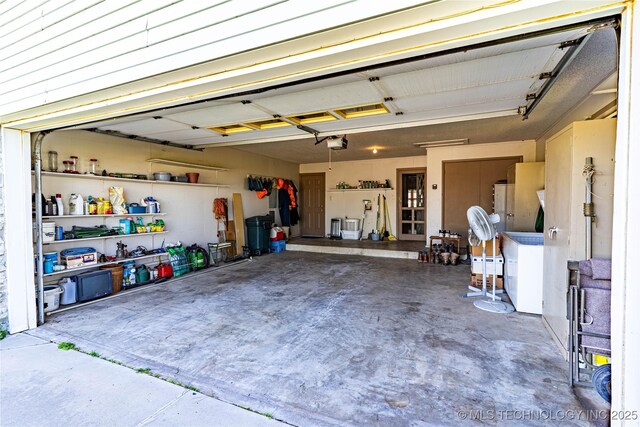 2445 E 156th St N, Skiatook, OK 74070 - garage featuring a garage door opener