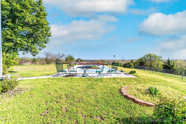 2445 E 156th St N, Skiatook, OK 74070 - view of yard featuring fence, a patio, and a swimming pool