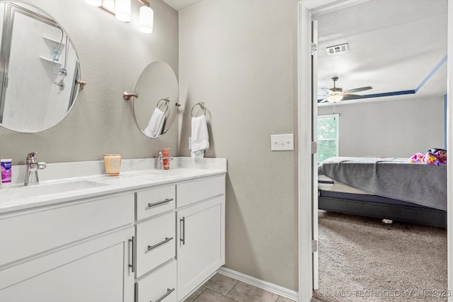 7201 S Joshua Ave, Broken Arrow, OK 74011 - bathroom with vanity, connected bathroom, ceiling fan, tile patterned floors, and visible vents