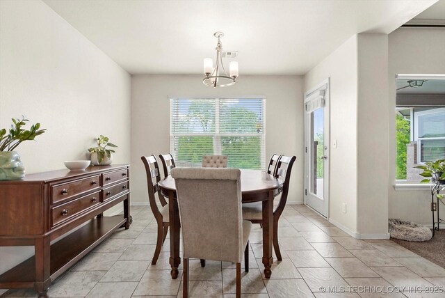 7201 S Joshua Ave, Broken Arrow, OK 74011 - dining room with plenty of natural light, visible vents, an inviting chandelier, and light tile patterned floors