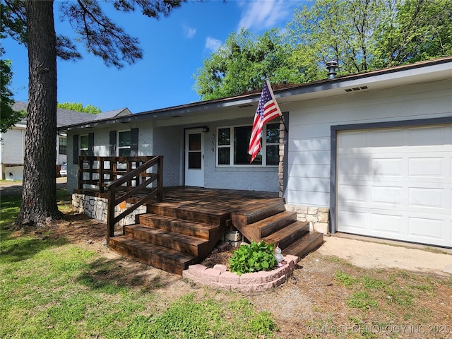 ranch-style home featuring a porch and an attached garage