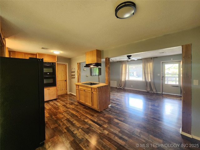 kitchen featuring a textured ceiling, dark wood-style flooring, visible vents, under cabinet range hood, and black appliances