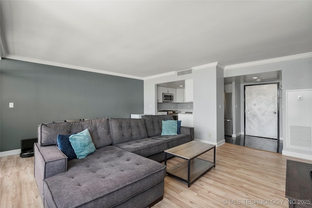 450 W 7th St Unit 1902, Tulsa, OK 74119 - living room with crown molding, visible vents, and light wood-type flooring