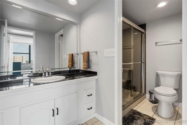 450 W 7th St Unit 1902, Tulsa, OK 74119 - bathroom featuring toilet, tile patterned flooring, and a stall shower