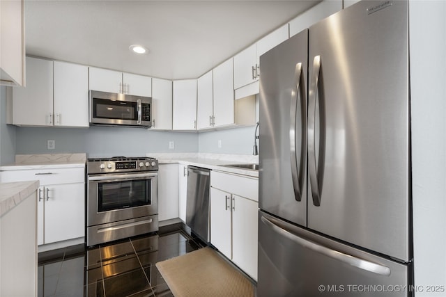 450 W 7th St Unit 1902, Tulsa, OK 74119 - kitchen featuring recessed lighting, white cabinetry, stainless steel appliances, and a sink