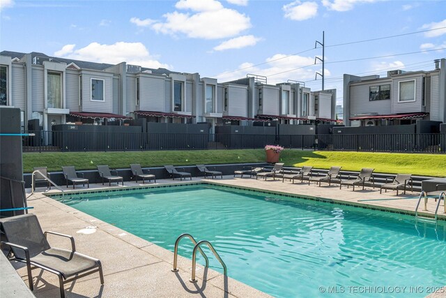 450 W 7th St Unit 1902, Tulsa, OK 74119 - pool with a patio area, fence, and a yard