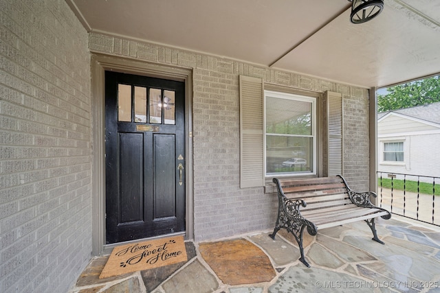 1136 S Evanston Ave, Tulsa, OK 74104 - property entrance featuring brick siding and a porch