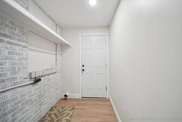 1136 S Evanston Ave, Tulsa, OK 74104 - laundry area featuring light wood-style flooring and baseboards