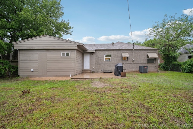 1136 S Evanston Ave, Tulsa, OK 74104 - rear view of house featuring a patio area, central air condition unit, and a yard