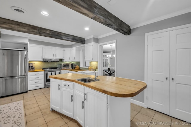 3334 S Wheeling Ave, Tulsa, OK 74105 - kitchen featuring a sink, butcher block countertops, beam ceiling, stainless steel appliances, and light tile patterned flooring