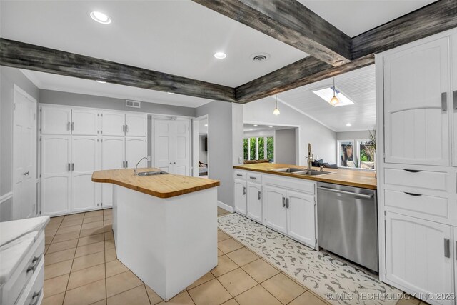 3334 S Wheeling Ave, Tulsa, OK 74105 - kitchen featuring stainless steel dishwasher, butcher block countertops, and a sink