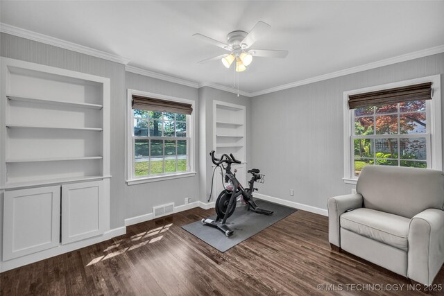 3334 S Wheeling Ave, Tulsa, OK 74105 - exercise room featuring baseboards, dark wood-type flooring, built in shelves, and crown molding