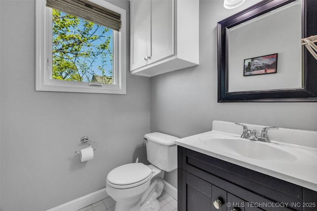3334 S Wheeling Ave, Tulsa, OK 74105 - half bathroom featuring toilet, tile patterned floors, vanity, and baseboards