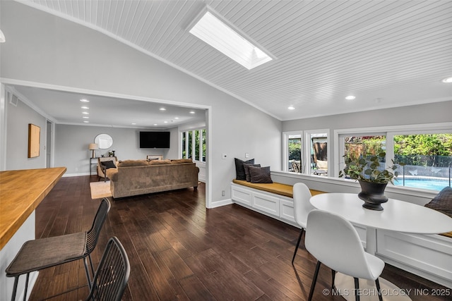 3334 S Wheeling Ave, Tulsa, OK 74105 - dining area featuring recessed lighting, vaulted ceiling with skylight, dark wood-type flooring, and plenty of natural light