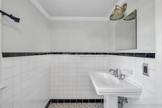 3334 S Wheeling Ave, Tulsa, OK 74105 - bathroom with tile walls, crown molding, a sink, and wainscoting