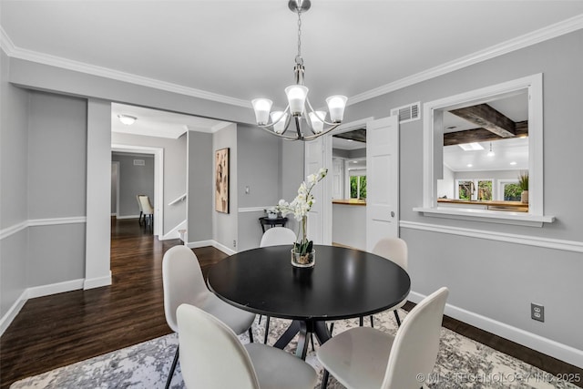 3334 S Wheeling Ave, Tulsa, OK 74105 - dining area featuring visible vents, a chandelier, wood finished floors, and baseboards