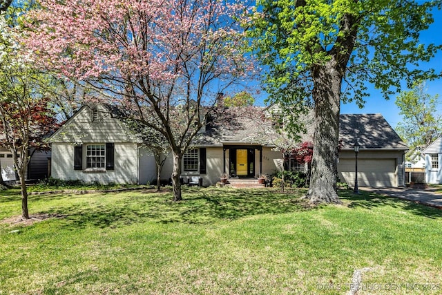 3334 S Wheeling Ave, Tulsa, OK 74105 - single story home with a front lawn, aphalt driveway, a chimney, and an attached garage