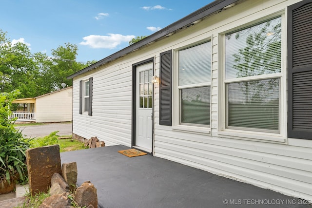 view of side of property with a patio area