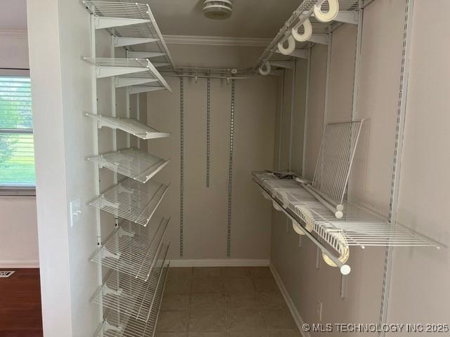 spacious closet featuring visible vents