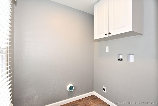 washroom featuring hookup for an electric dryer, dark wood-style flooring, cabinet space, baseboards, and hookup for a washing machine