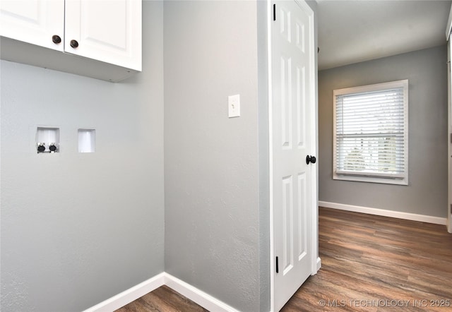laundry room with baseboards, hookup for a washing machine, dark wood finished floors, and cabinet space