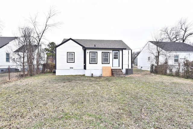 view of front facade with a fenced backyard, central air condition unit, entry steps, and a front yard