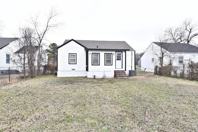 view of front of home featuring a fenced backyard, central AC, a front yard, and entry steps