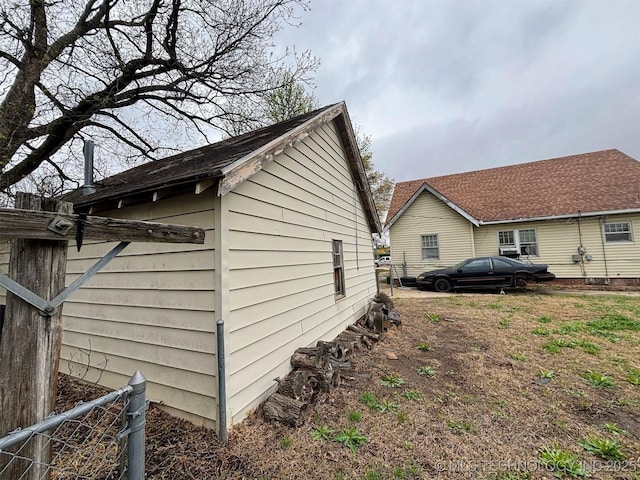 view of side of property with fence